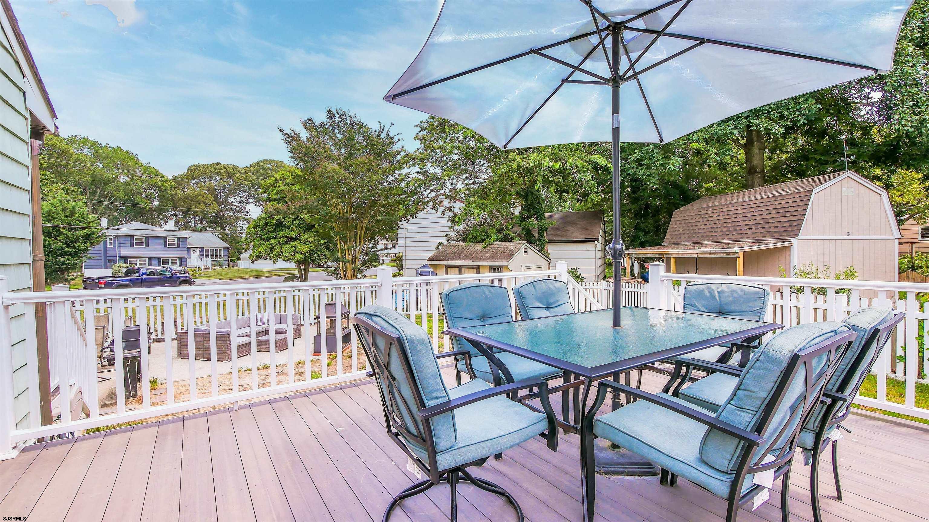 2 Rose Lane Somers Point, NJ 08244 - Photo 28 of 43 an outdoor space with furniture and umbrella