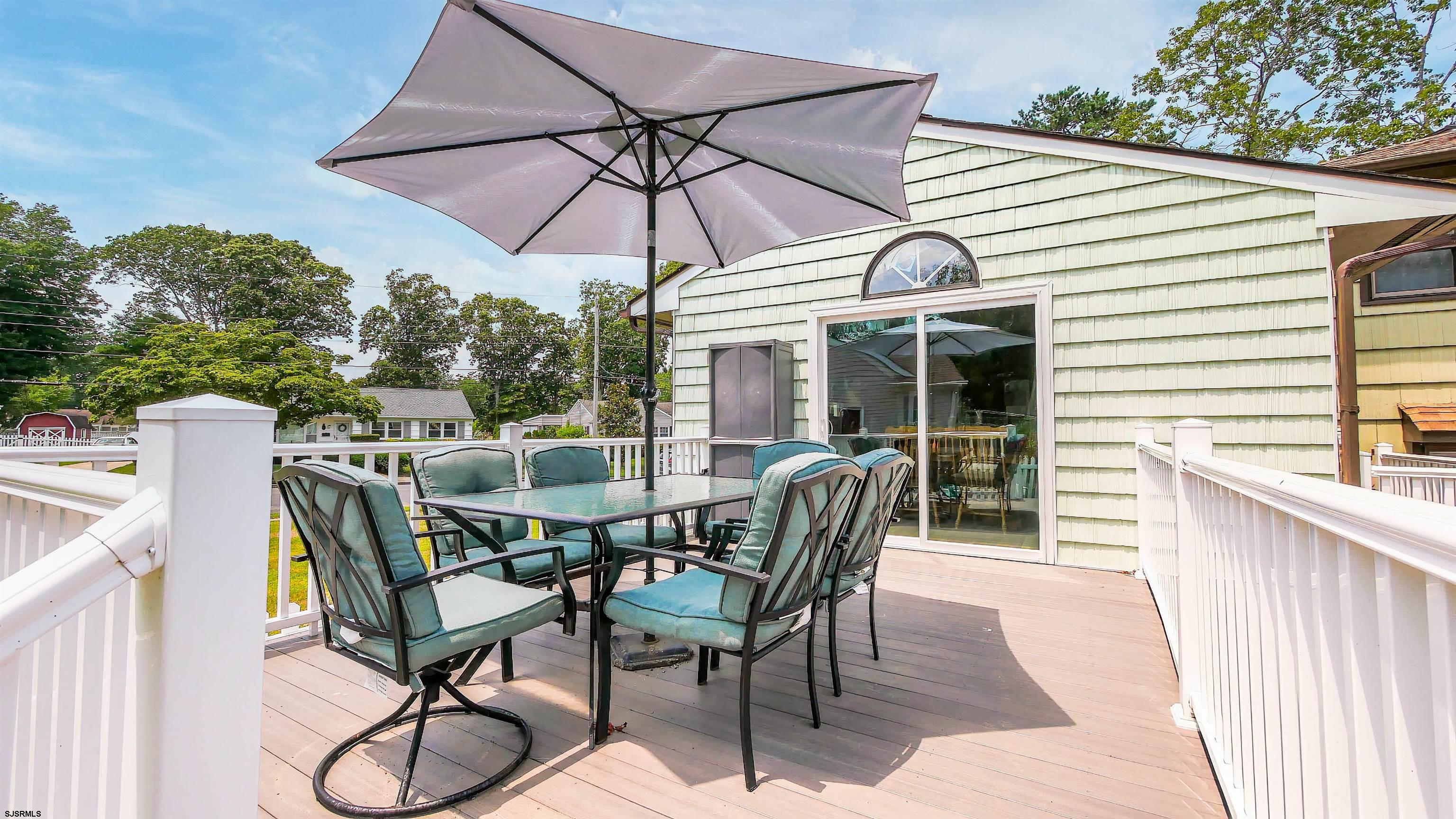 2 Rose Lane Somers Point, NJ 08244 - Photo 31 of 43 a view of a patio with a table chairs and a barbeque