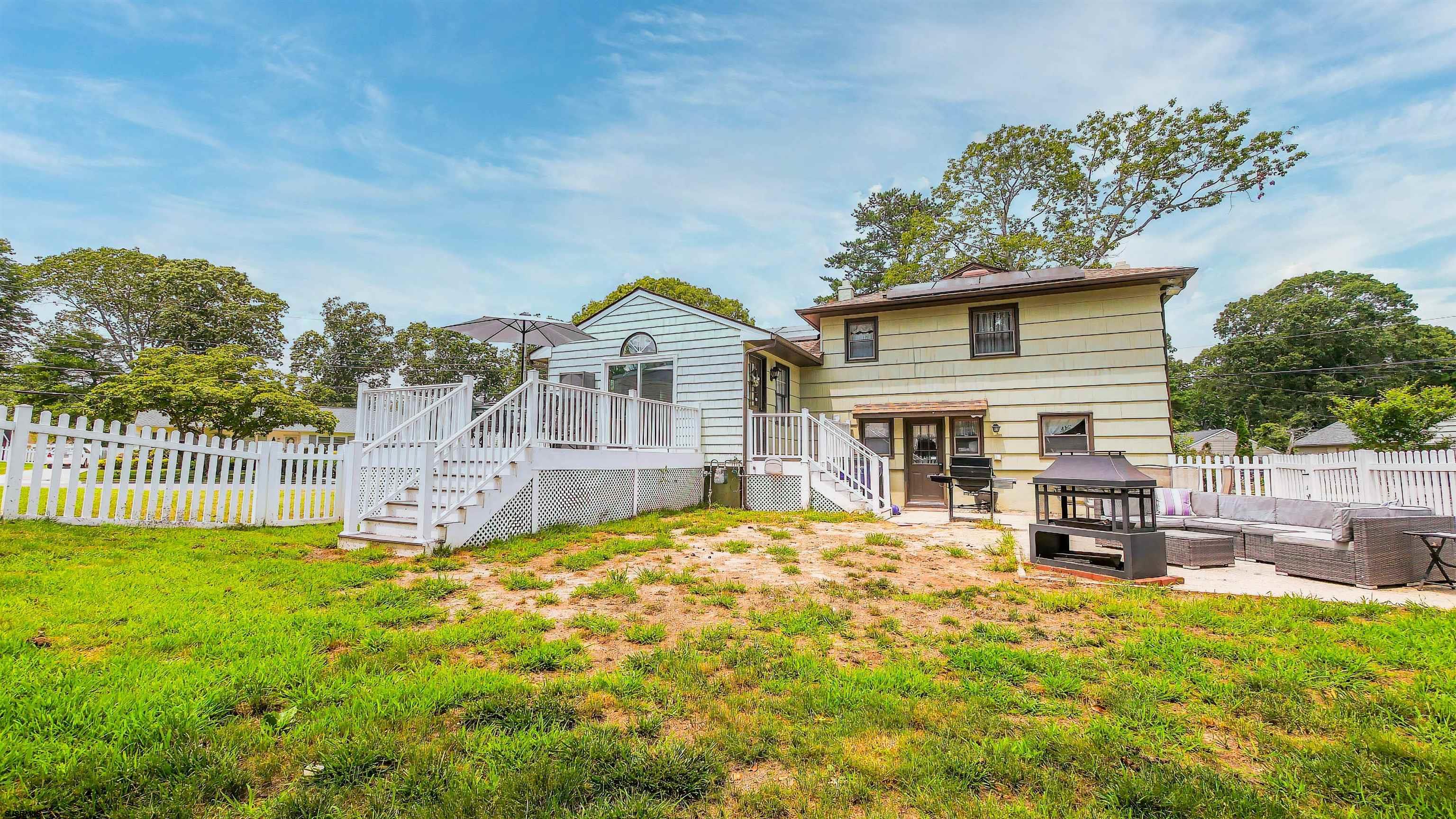 2 Rose Lane Somers Point, NJ 08244 - Photo 34 of 43 a view of a house with a small yard and wooden fence