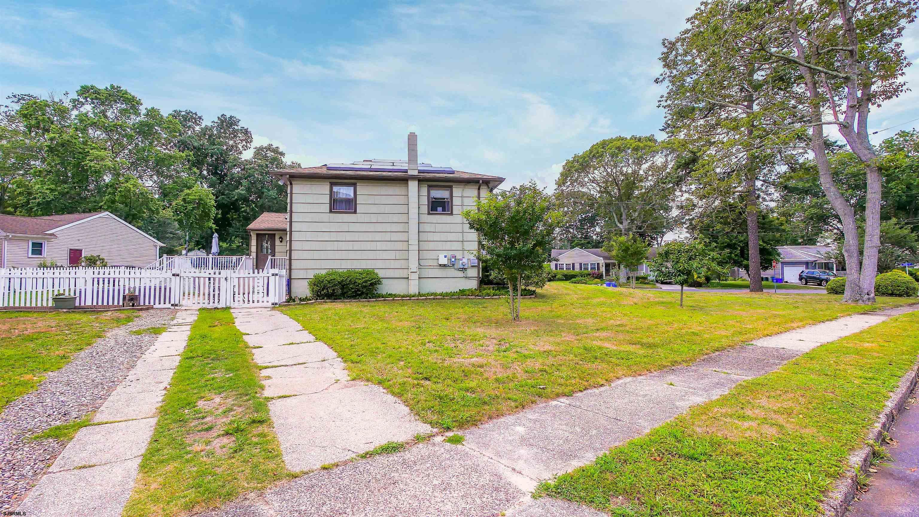 2 Rose Lane Somers Point, NJ 08244 - Photo 38 of 43 a view of house with swimming pool outdoor seating and trees