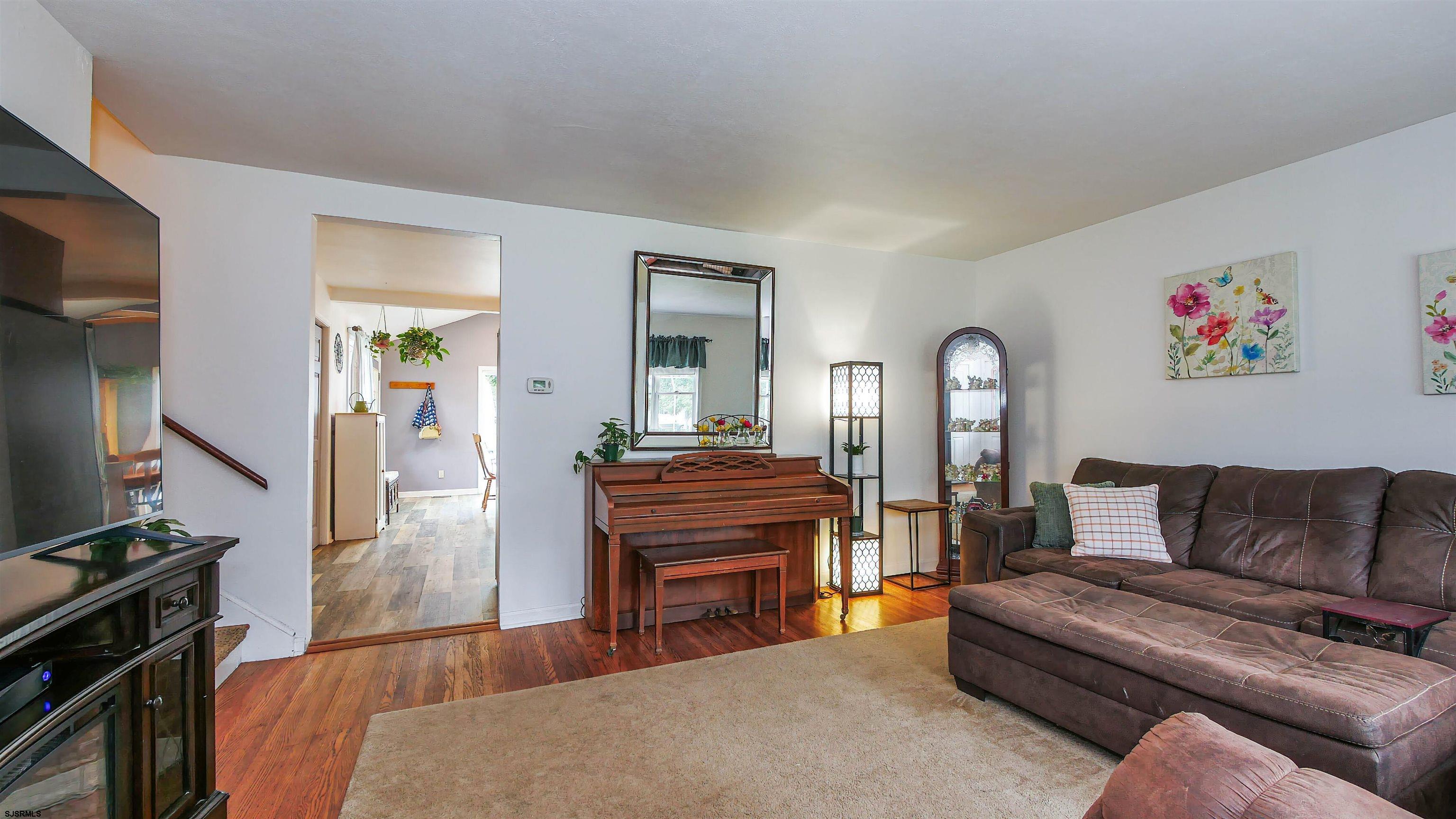 2 Rose Lane Somers Point, NJ 08244 - Photo 4 of 43 a living room with furniture and a flat screen tv