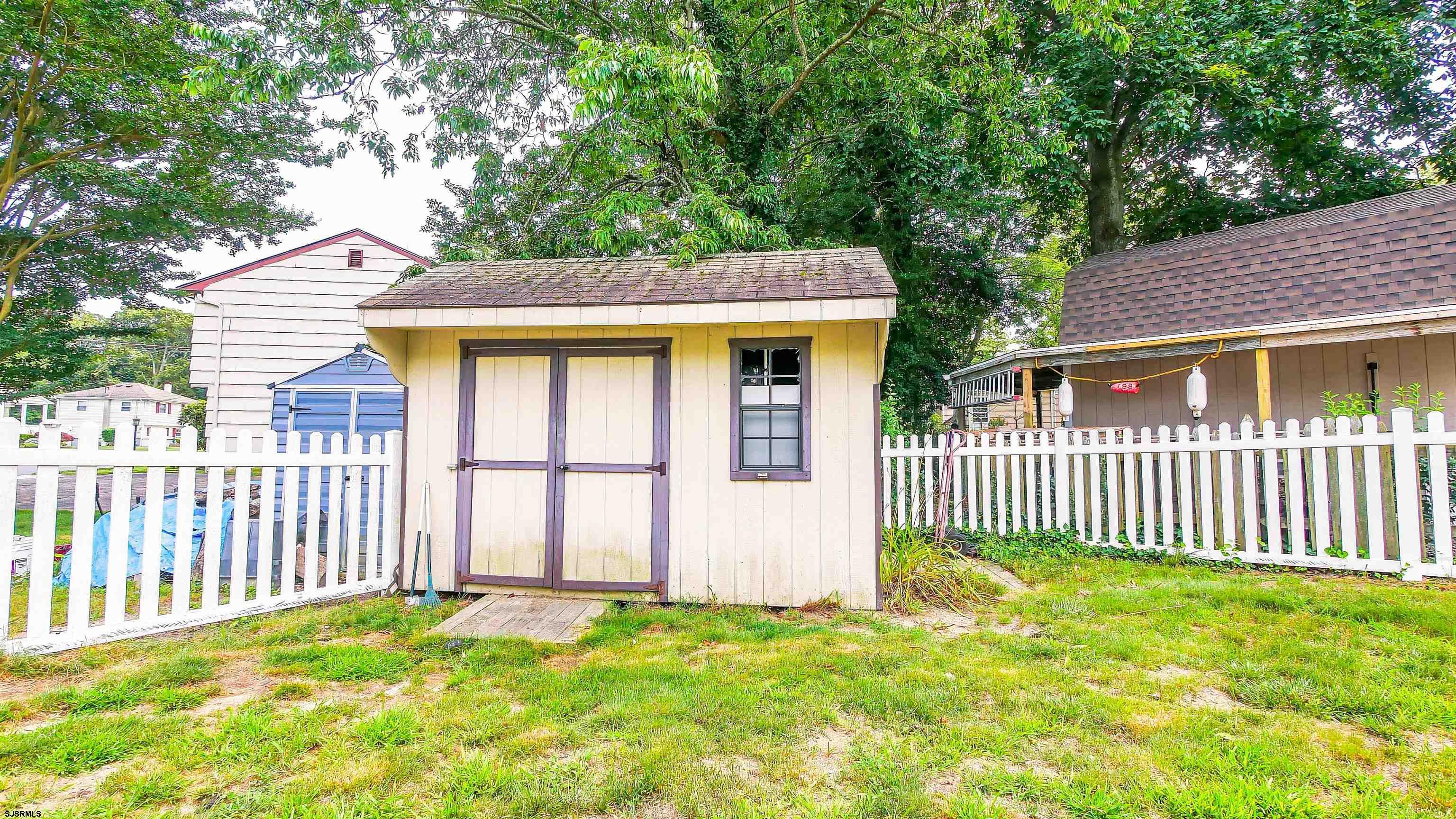 2 Rose Lane Somers Point, NJ 08244 - Photo 42 of 43 a front view of a house with a garden
