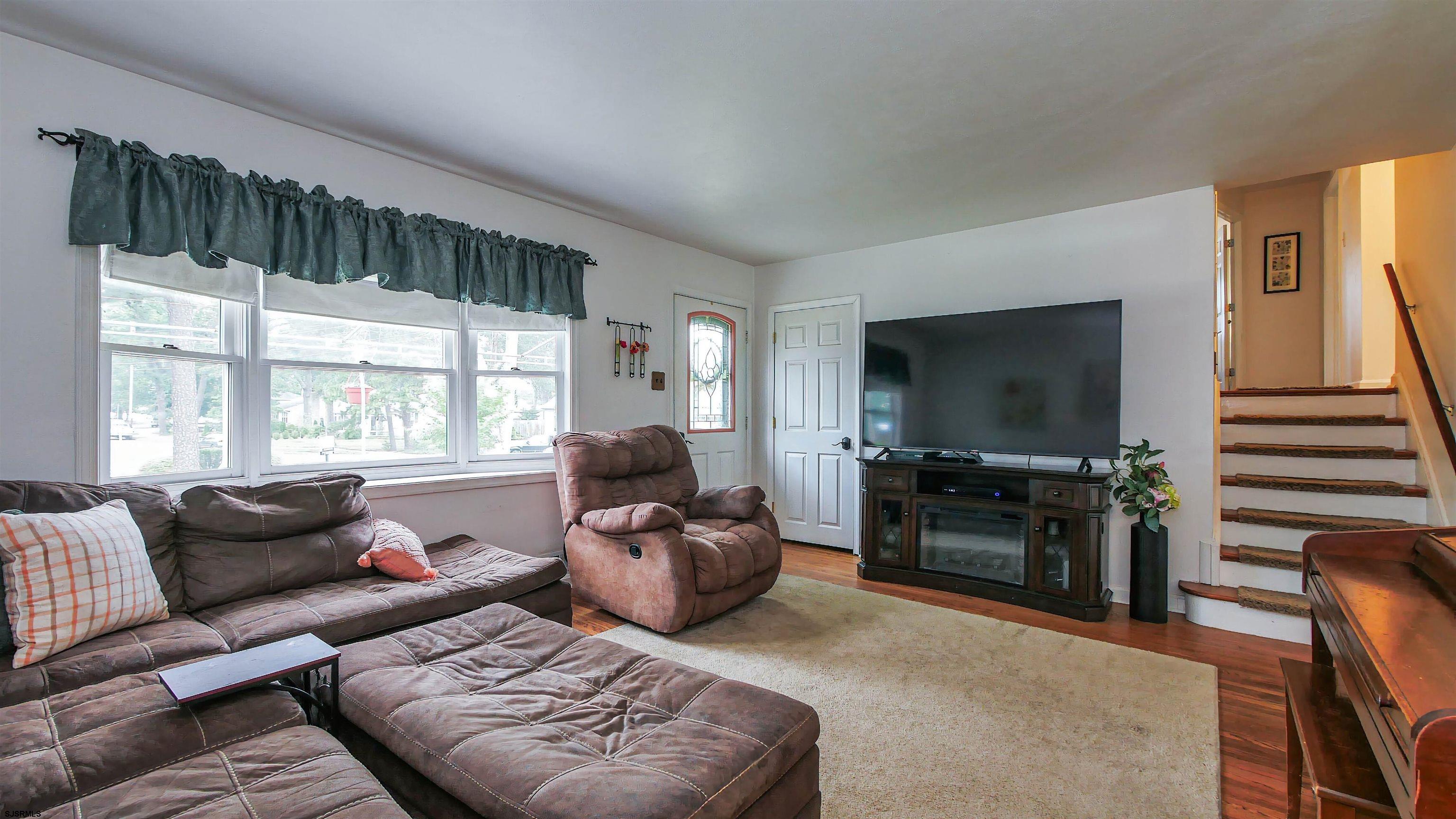 2 Rose Lane Somers Point, NJ 08244 - Photo 6 of 43 a living room with furniture and a flat screen tv