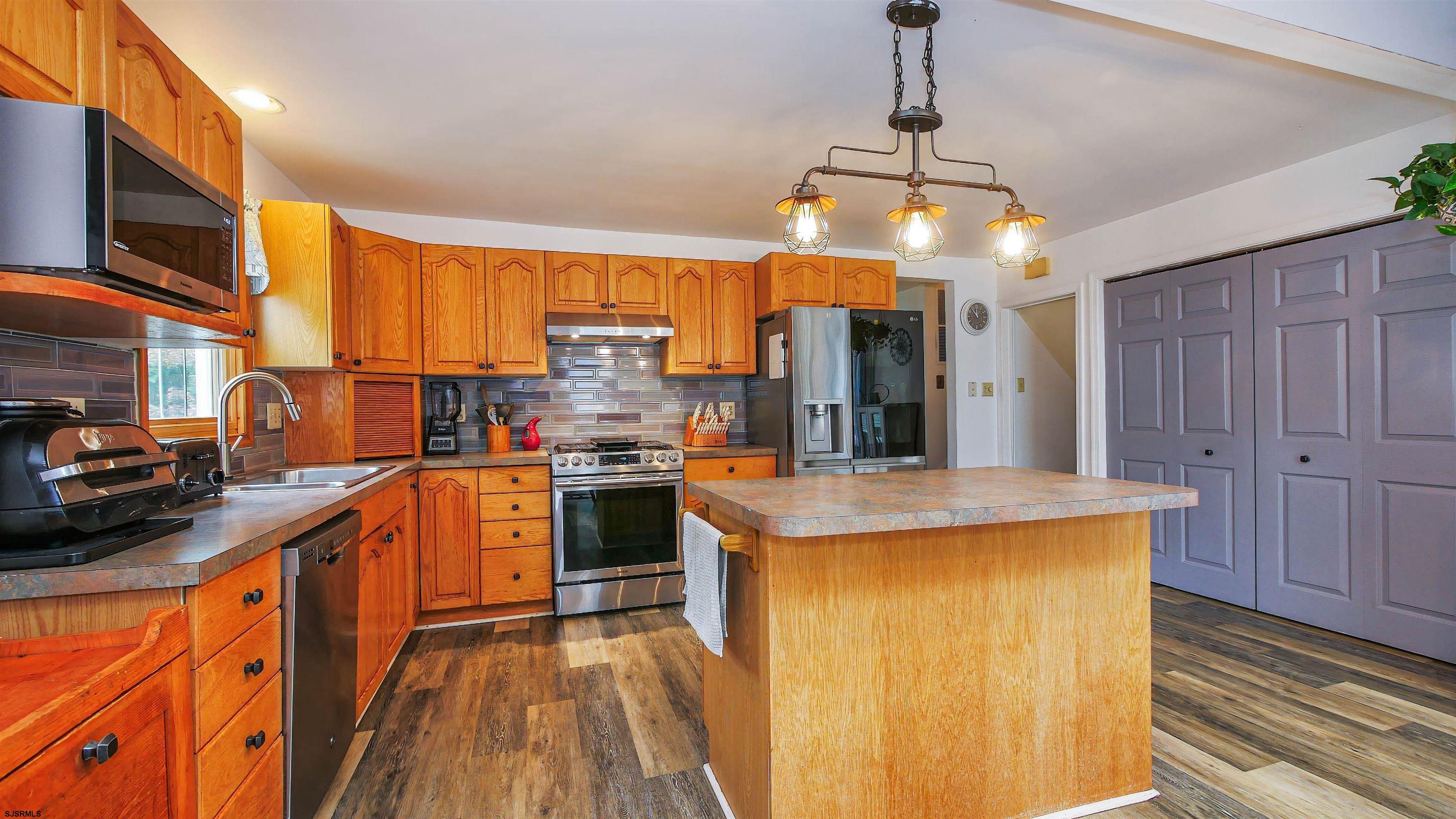 2 Rose Lane Somers Point, NJ 08244 - Photo 9 of 43 a kitchen that has a lot of cabinets in it