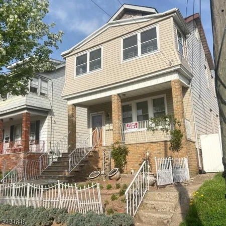 a front view of a house with a porch