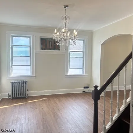 a view of livingroom with window and hardwood floor