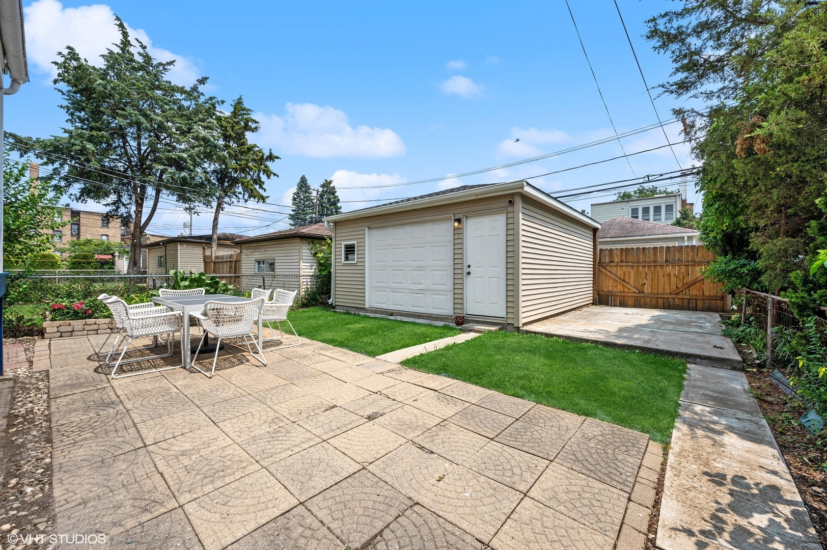 3125 North Springfield Avenue Chicago, IL 60618 - Photo 18 of 22 a view of a patio with a table and chairs under an umbrella
