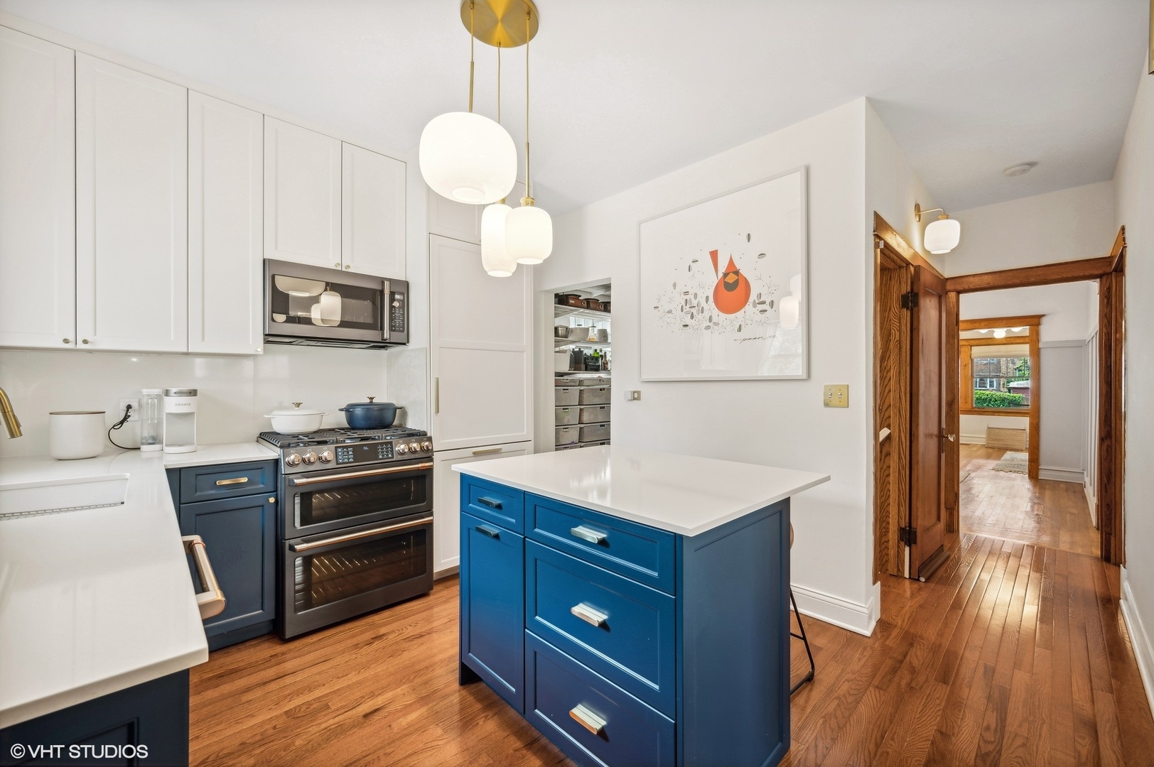 3125 North Springfield Avenue Chicago, IL 60618 - Photo 6 of 22 a kitchen with stainless steel appliances a stove a sink and a refrigerator