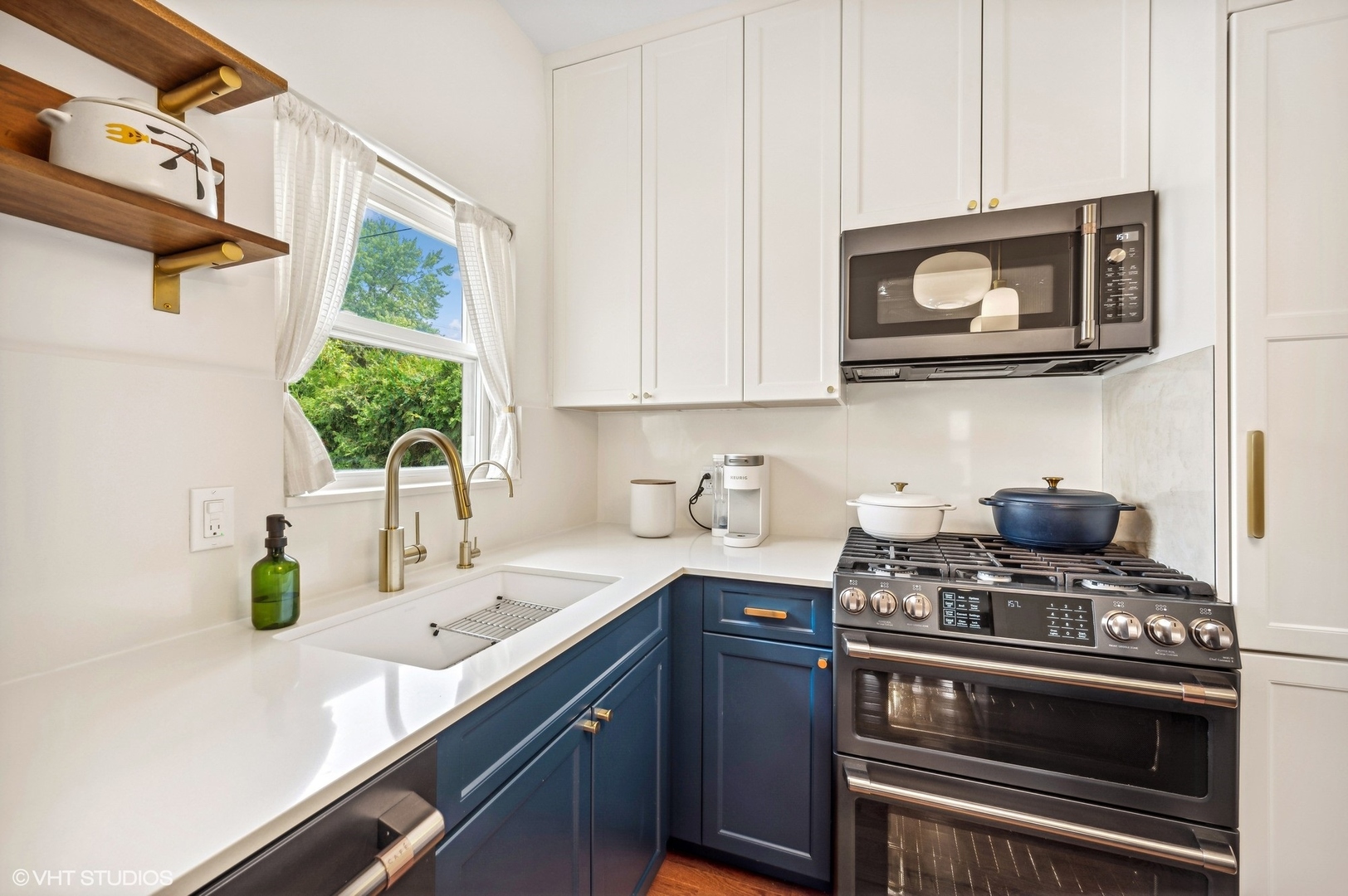 3125 North Springfield Avenue Chicago, IL 60618 - Photo 7 of 22 a kitchen with a stove and a sink