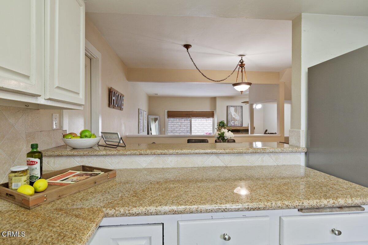 5024 West Wooley Road Oxnard, CA 93035 - Photo 12 of 33 a view of a kitchen with a sink a counter space and appliances