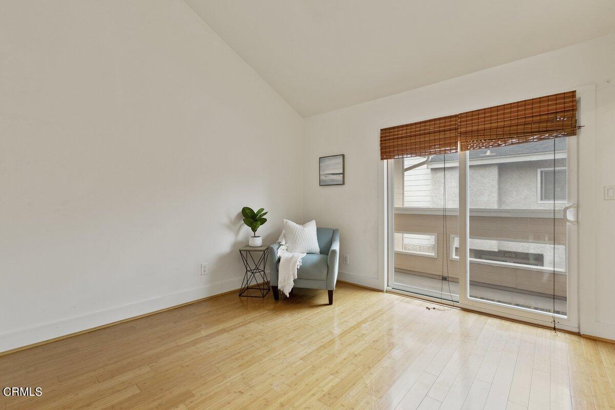 5024 West Wooley Road Oxnard, CA 93035 - Photo 21 of 33 a bed room with a bed and a chair