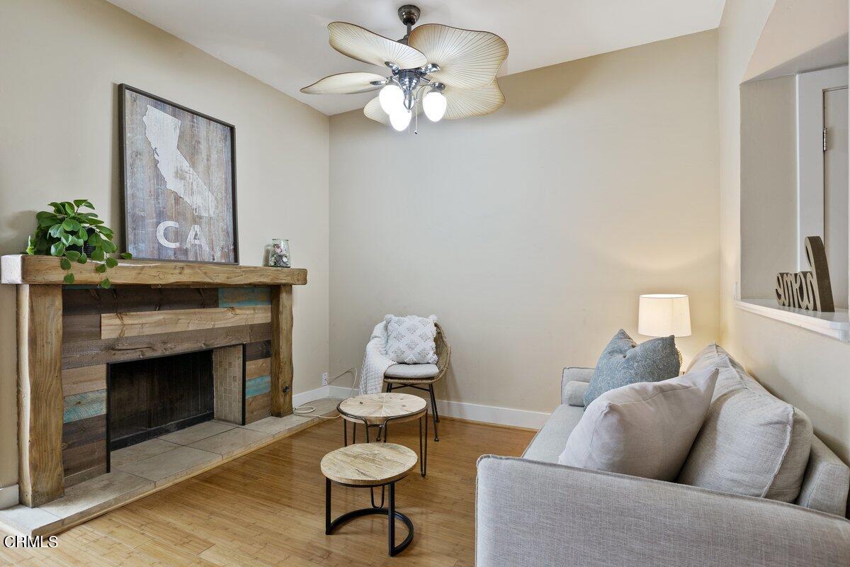 5024 West Wooley Road Oxnard, CA 93035 - Photo 3 of 33 a living room with furniture a fireplace and a flat screen tv