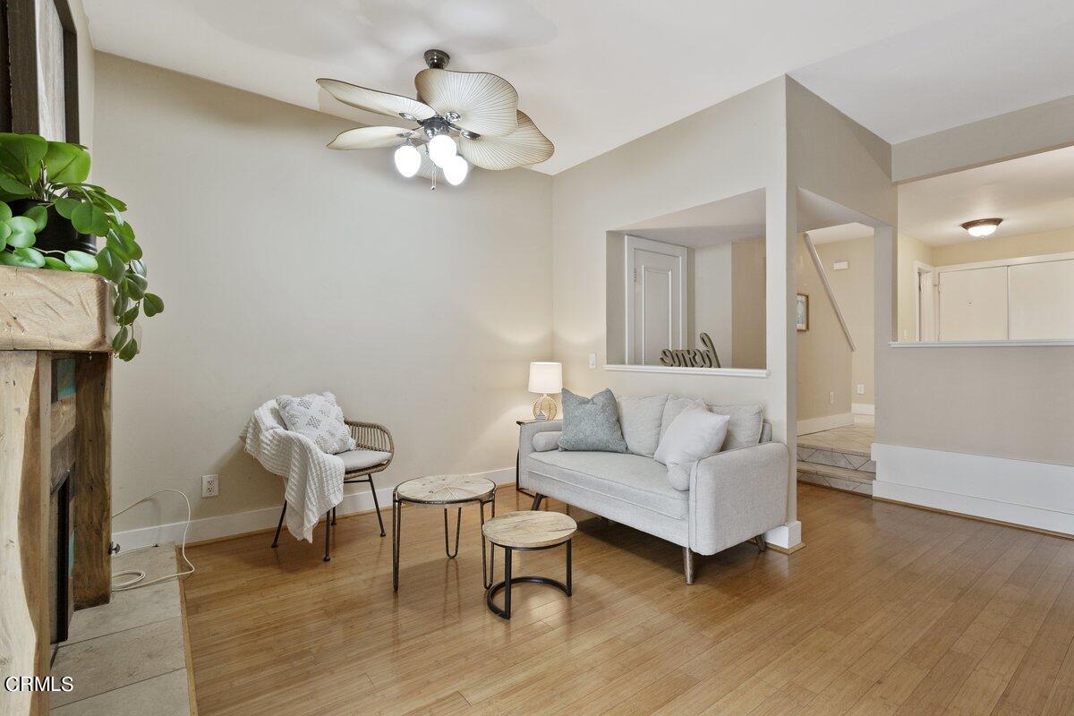 5024 West Wooley Road Oxnard, CA 93035 - Photo 6 of 33 a living room with furniture and a chandelier