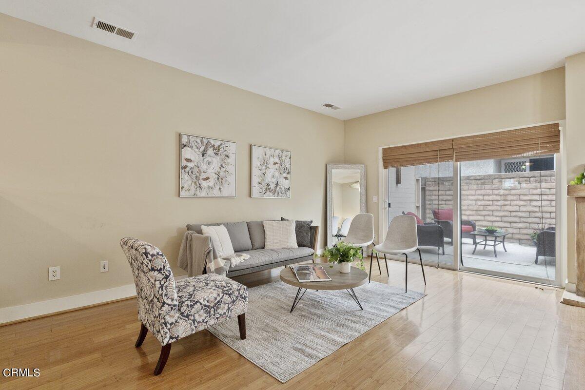 5024 West Wooley Road Oxnard, CA 93035 - Photo 7 of 33 a living room with furniture and a wooden floor