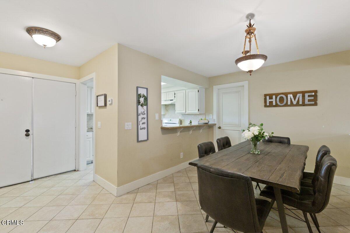5024 West Wooley Road Oxnard, CA 93035 - Photo 9 of 33 a view of kitchen and dining area with a sink