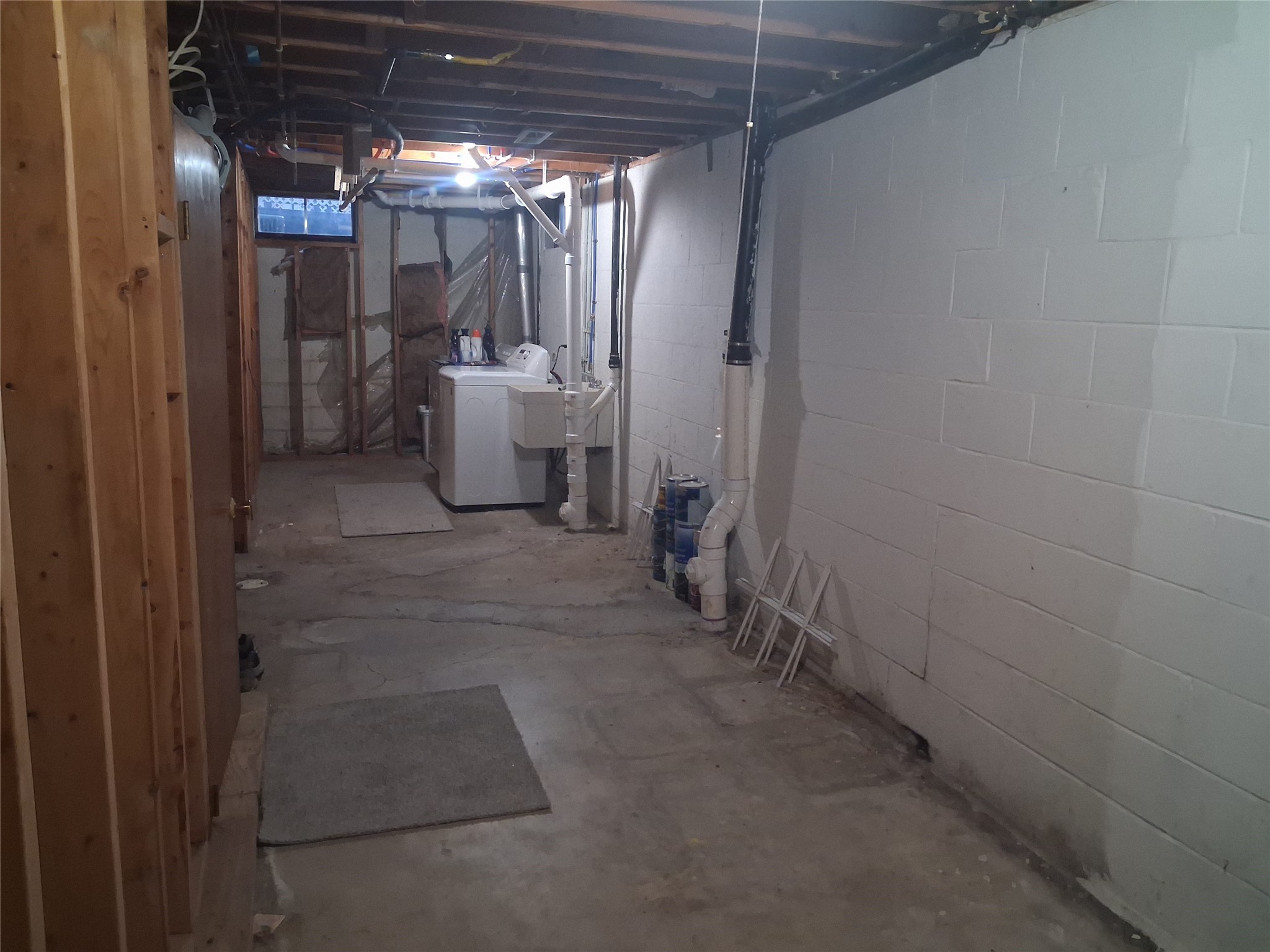 3918 Winchester Road Erie, PA 16506 - Photo 36 of 49 ONE END OF THE BASEMENT IS LAUNDRY SPACE AND STORAGE. THE OTHER END IS MORE STORAGE SPACE.