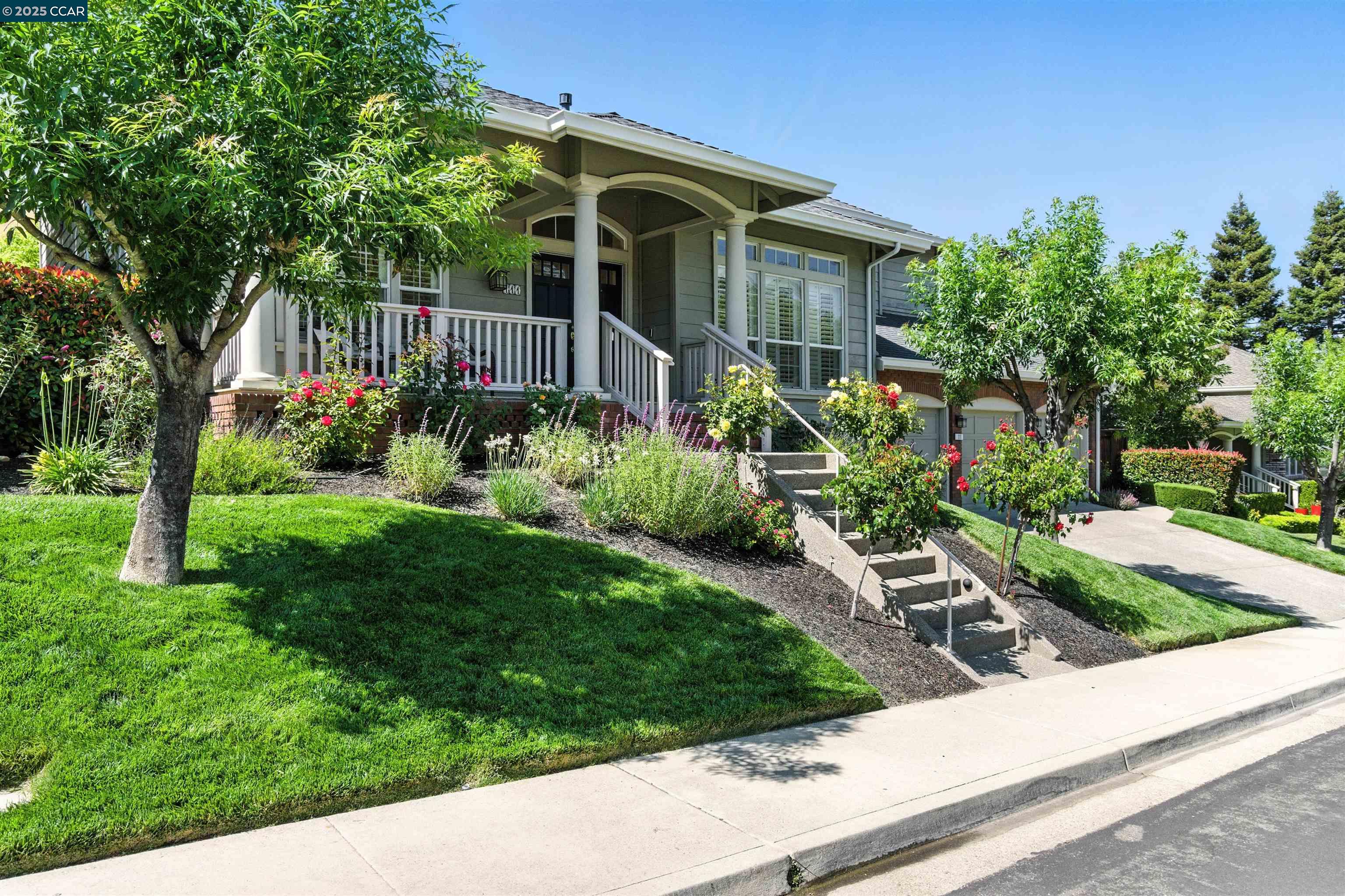 a front view of house with yard and green space
