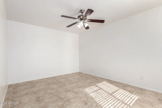 a kitchen with granite countertop white cabinets white stainless steel appliances and sink