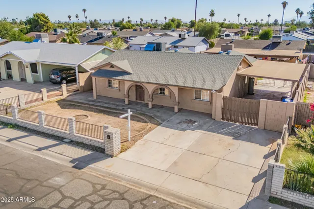 an aerial view of a house with a swimming pool