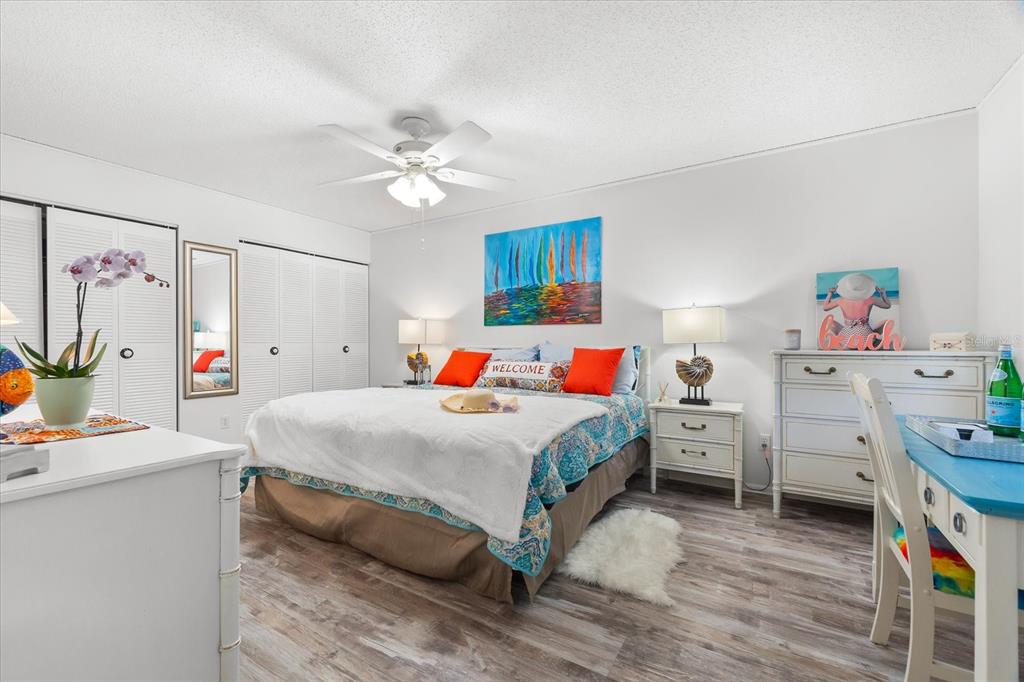 5641 Midnight Pass Road, Unit 902 Sarasota, FL 34242 - Photo 17 of 81 a bed room with a bed and a desk