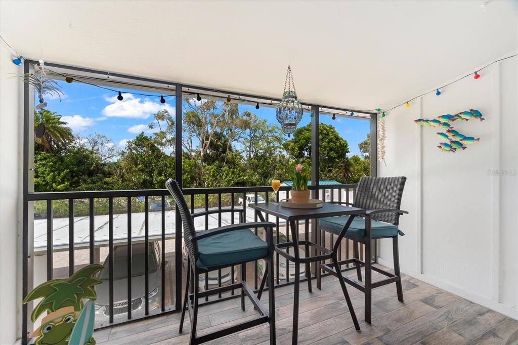 5641 Midnight Pass Road, Unit 902 Sarasota, FL 34242 - Photo 23 of 81 a view of a dining room with furniture window and outside view