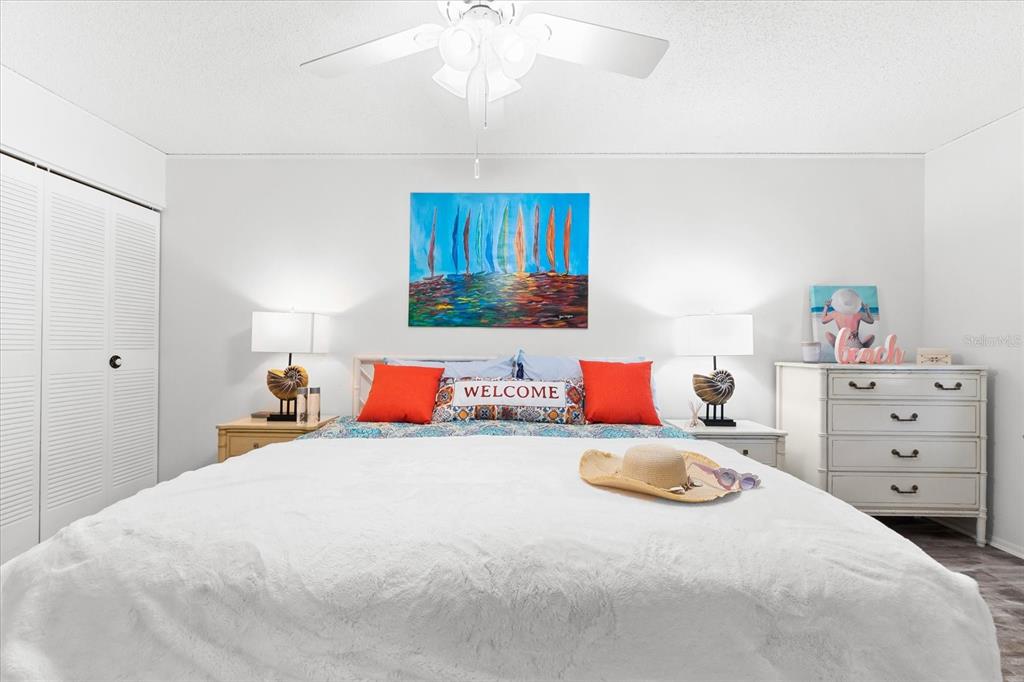 5641 Midnight Pass Road, Unit 902 Sarasota, FL 34242 - Photo 29 of 81 a bedroom with a bed and a dresser