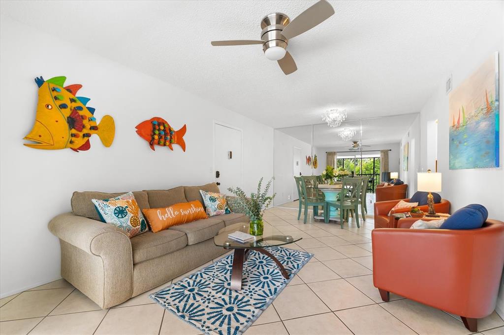 5641 Midnight Pass Road, Unit 902 Sarasota, FL 34242 - Photo 35 of 81 a living room with furniture and white walls