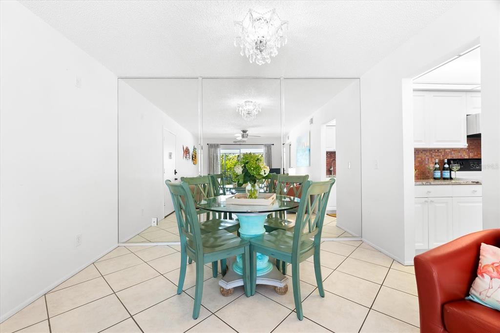 5641 Midnight Pass Road, Unit 902 Sarasota, FL 34242 - Photo 44 of 81 a view of a dining room with furniture