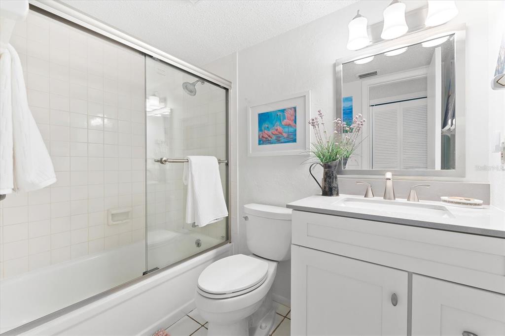 5641 Midnight Pass Road, Unit 902 Sarasota, FL 34242 - Photo 48 of 81 a bathroom with a sink toilet and shower