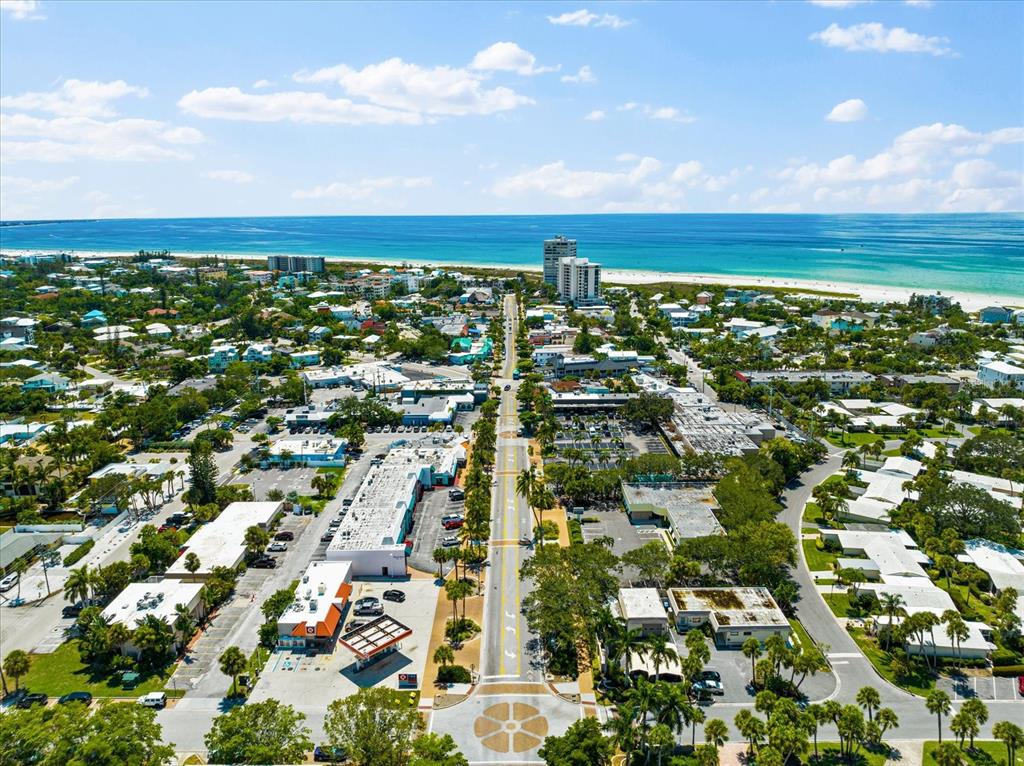 5641 Midnight Pass Road, Unit 902 Sarasota, FL 34242 - Photo 53 of 81 an aerial view of residential building and ocean