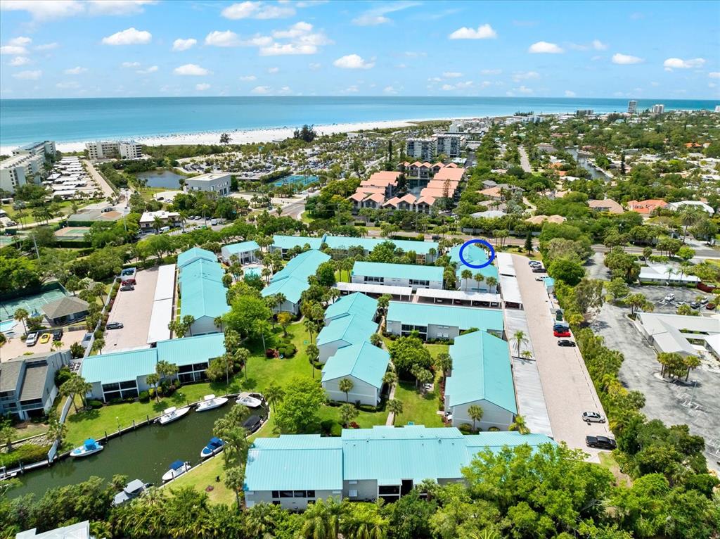5641 Midnight Pass Road, Unit 902 Sarasota, FL 34242 - Photo 74 of 81 an aerial view of residential houses with outdoor space and swimming pool