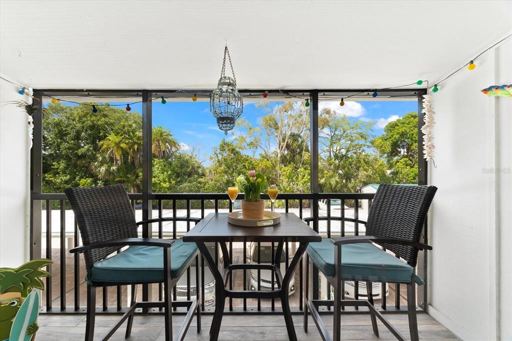 5641 Midnight Pass Road, Unit 902 Sarasota, FL 34242 - Photo 10 of 81 a view of a dining room with furniture window and outside view