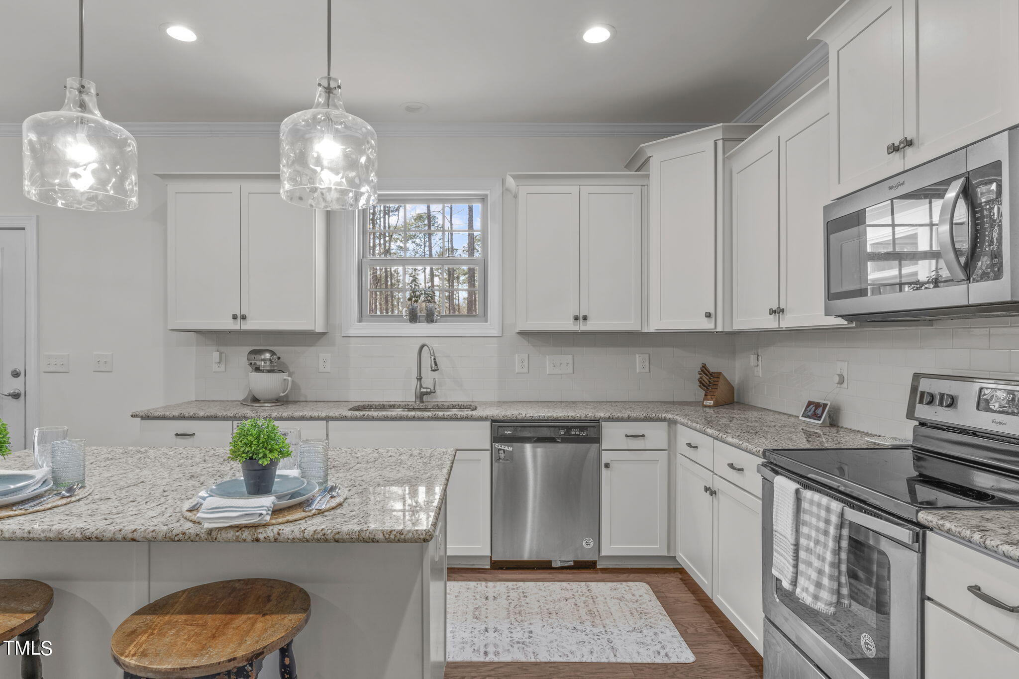 9716 Chris Drive Raleigh, NC 27603 - Photo 20 of 41 Beautiful cabinetry with lots of storage