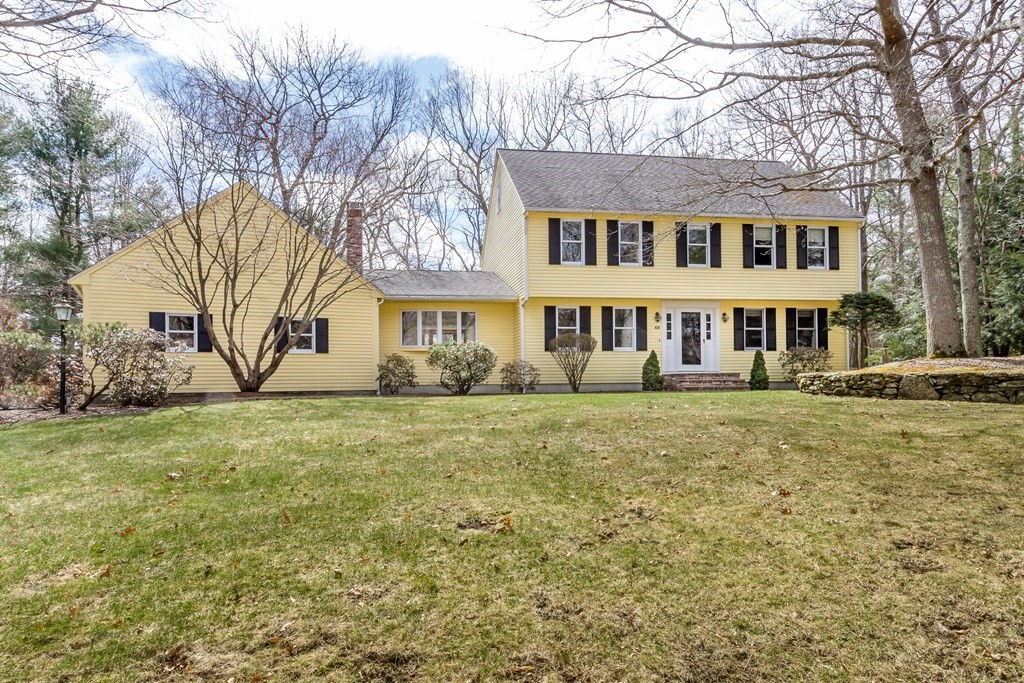49 Angela Street Canton, MA 02021 - Photo 1 of 25 a front view of a house with a yard and trees