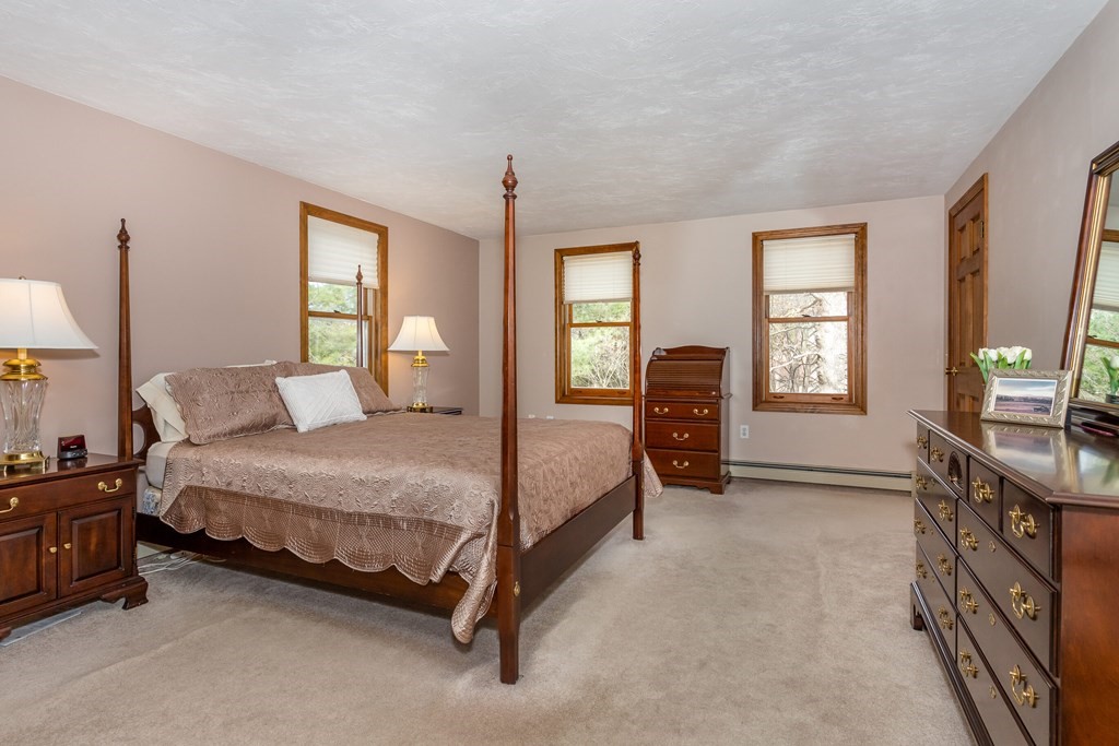 49 Angela Street Canton, MA 02021 - Photo 14 of 25 a bedroom with a bed and a window