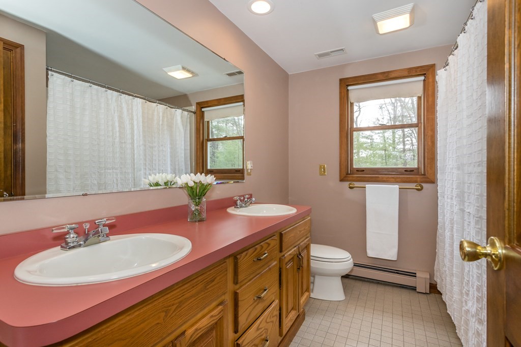 49 Angela Street Canton, MA 02021 - Photo 15 of 25 a bathroom with a double vanity sink toilet and a mirror