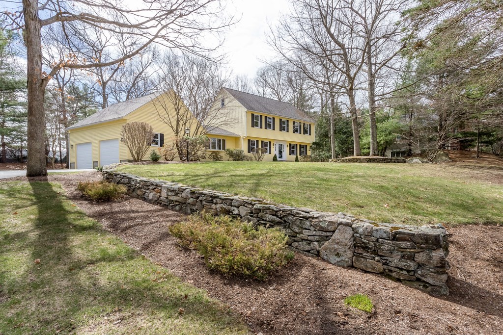 49 Angela Street Canton, MA 02021 - Photo 2 of 25 a view of a big yard in front of a house