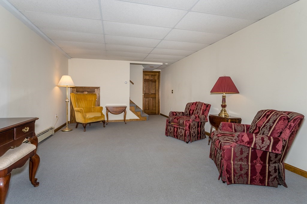 49 Angela Street Canton, MA 02021 - Photo 21 of 25 a living room with furniture and a lamp