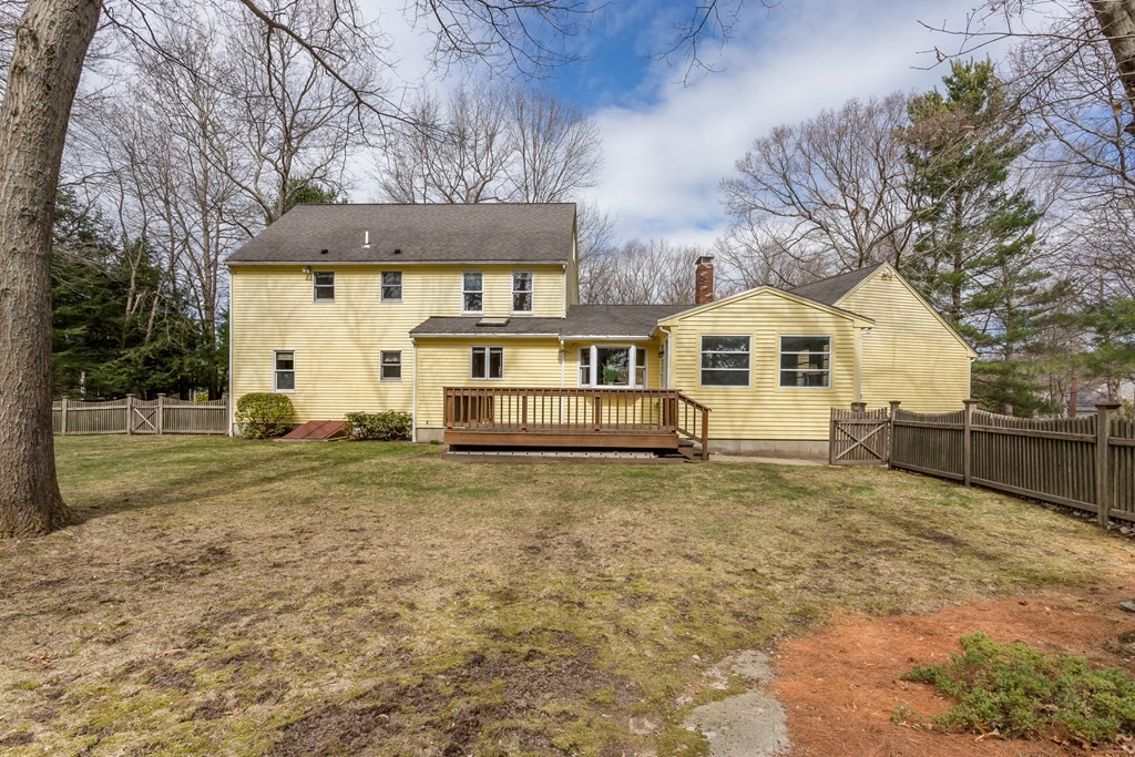 49 Angela Street Canton, MA 02021 - Photo 22 of 25 a view of a white house with a yard