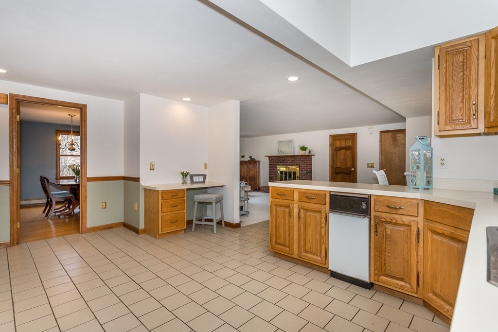 49 Angela Street Canton, MA 02021 - Photo 8 of 25 a kitchen with a sink and chairs