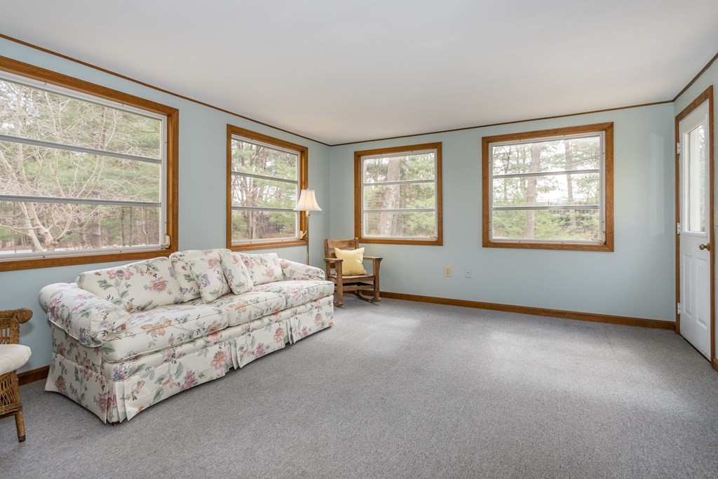 49 Angela Street Canton, MA 02021 - Photo 10 of 25 a living room with furniture and a large window