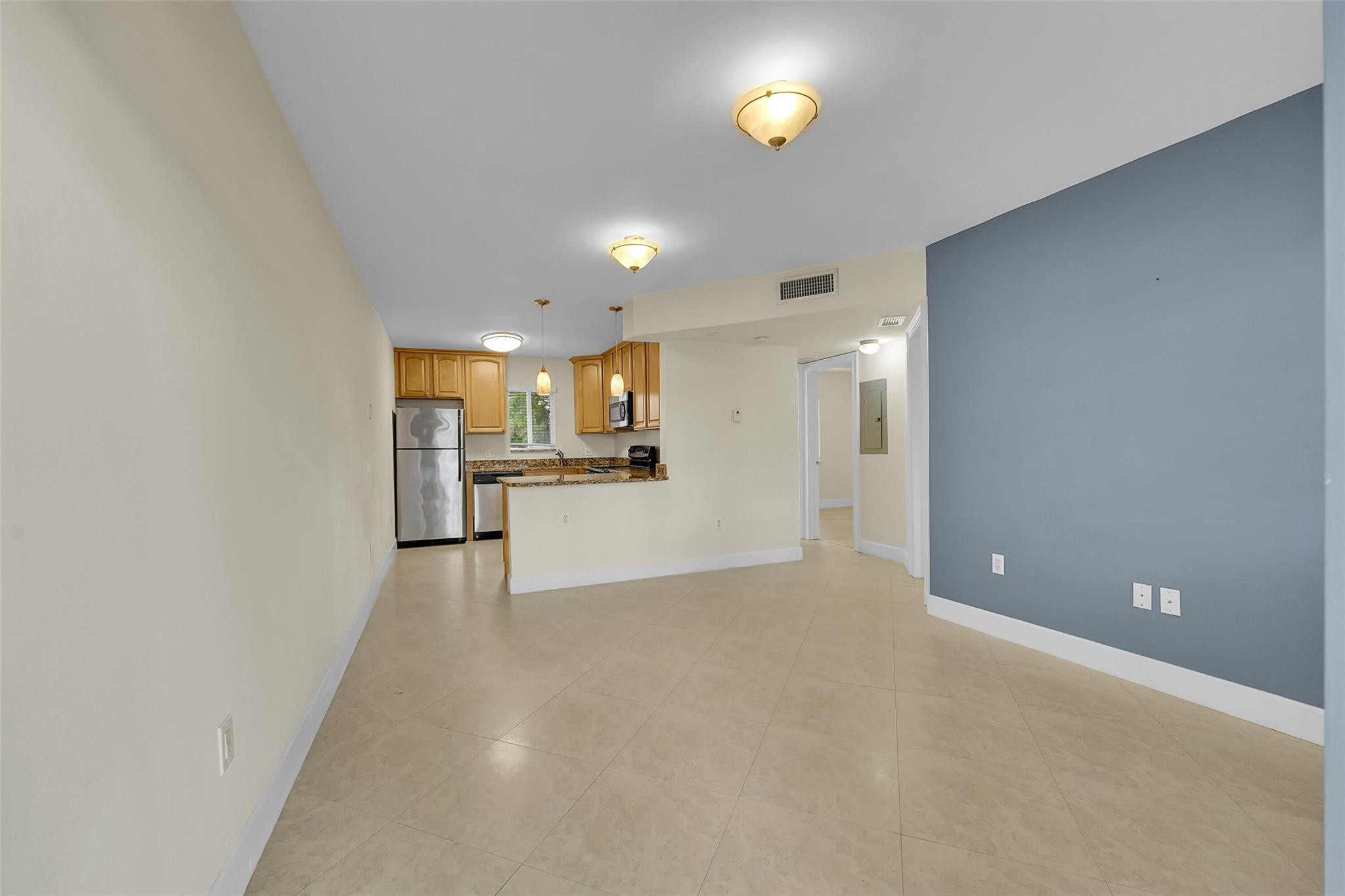 410 Southwest 15th Street, Unit 103 Pompano Beach, FL 33060 - Photo 3 of 16 a view of a kitchen with a sink and cabinets