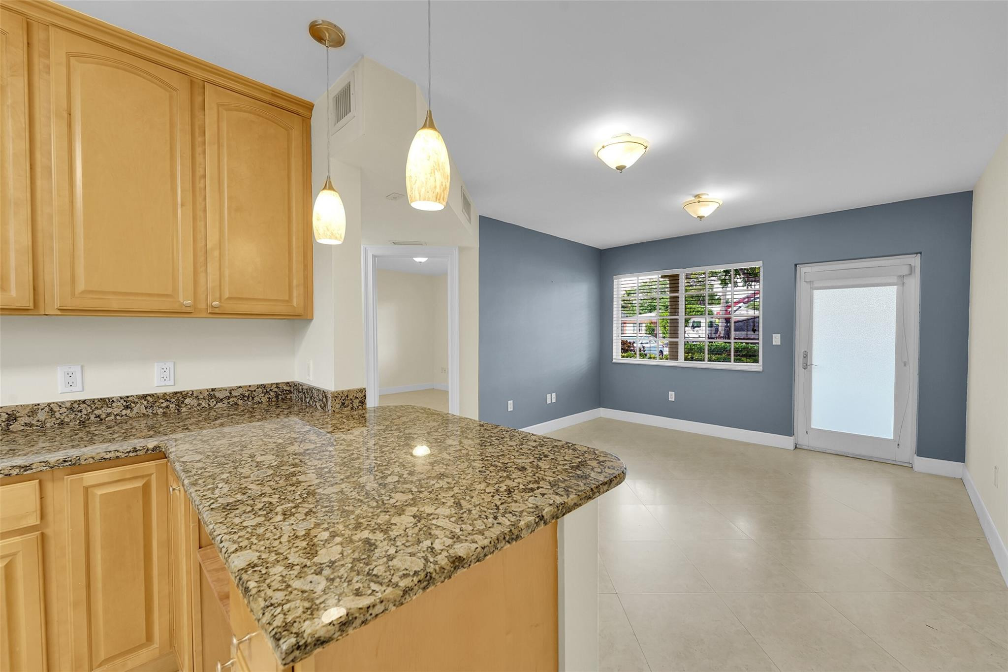 410 Southwest 15th Street, Unit 103 Pompano Beach, FL 33060 - Photo 9 of 16 a view of a kitchen with a sink and cabinets
