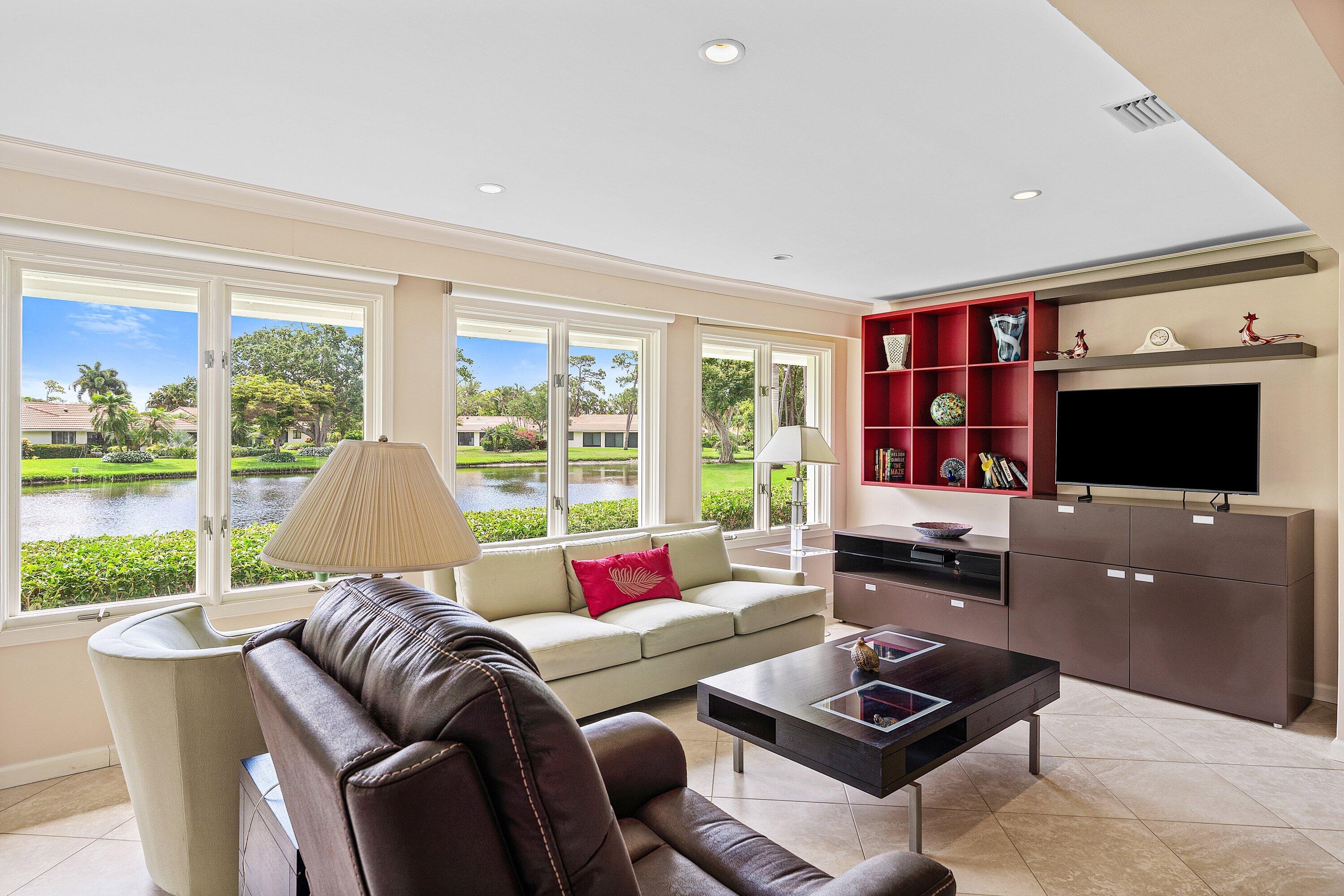 4365 Shell Drake Lane Boynton Beach, FL 33436 - Photo 12 of 56 a living room with furniture and a flat screen tv