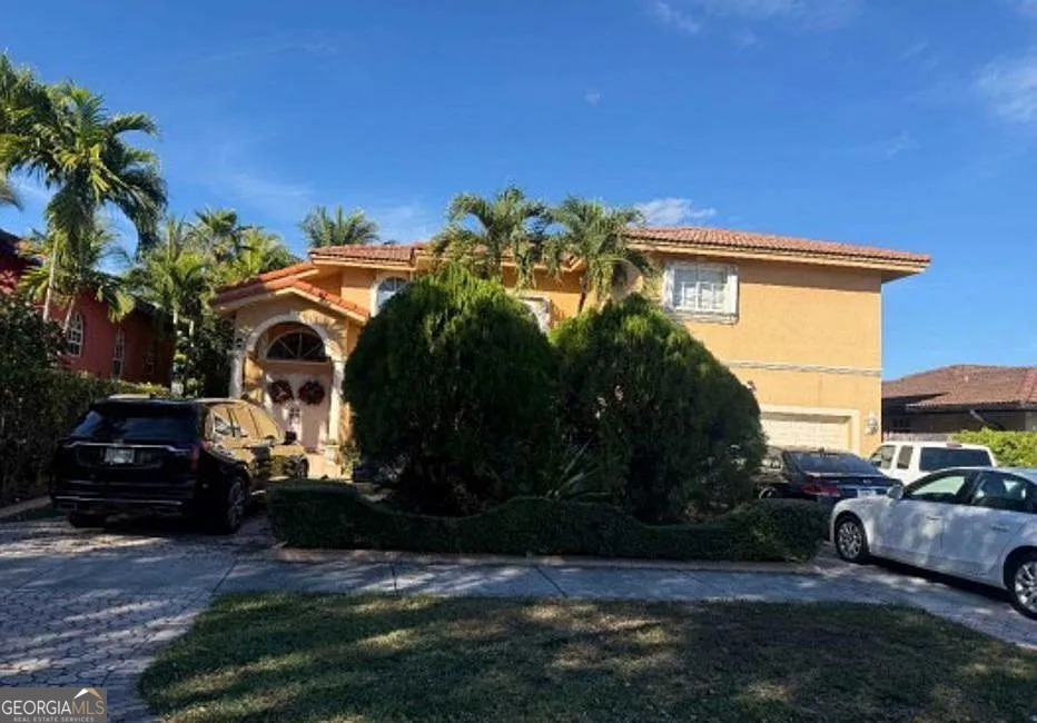 16013 Southwest 43rd Street Miami, FL 33185 - Photo 2 of 6 a front view of a house with a yard