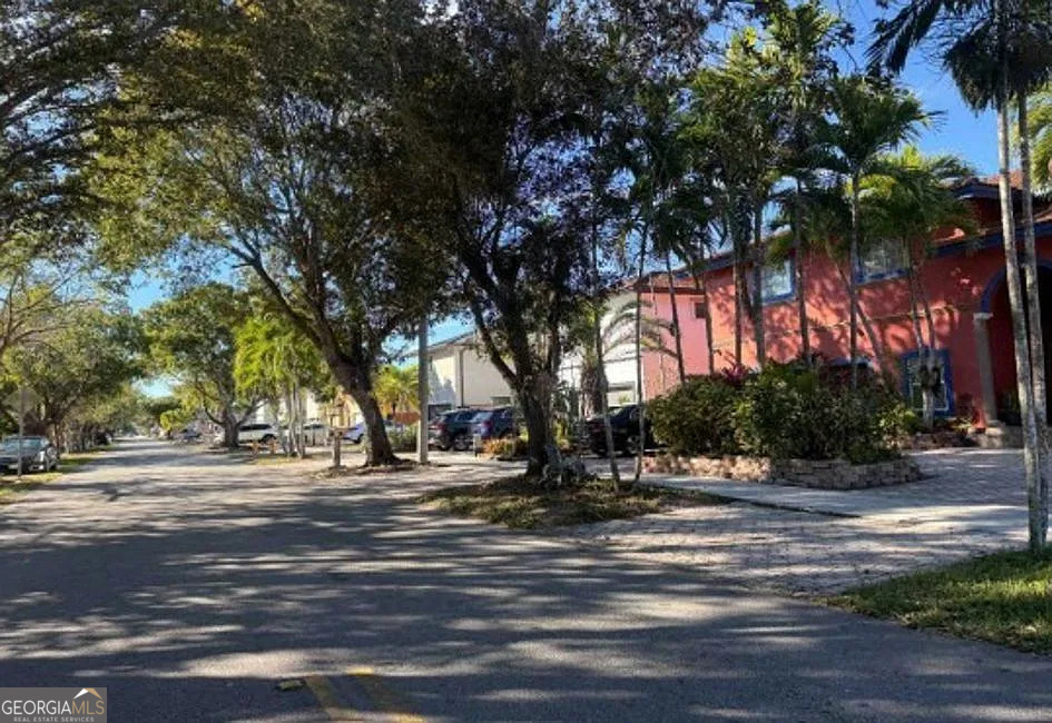 16013 Southwest 43rd Street Miami, FL 33185 - Photo 5 of 6 a view of street with tree s