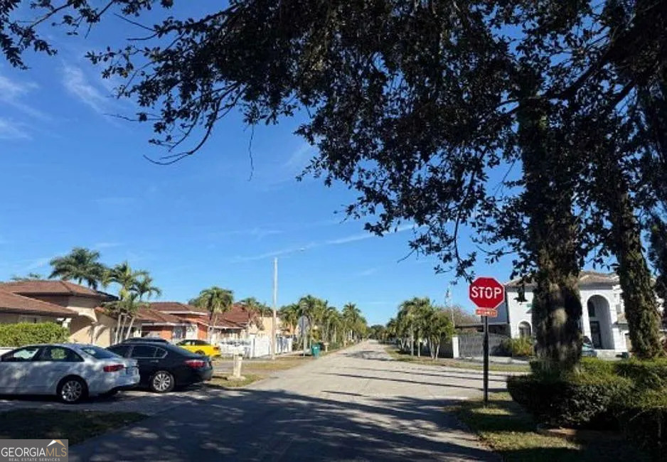 16013 Southwest 43rd Street Miami, FL 33185 - Photo 6 of 6 a view of street with cars