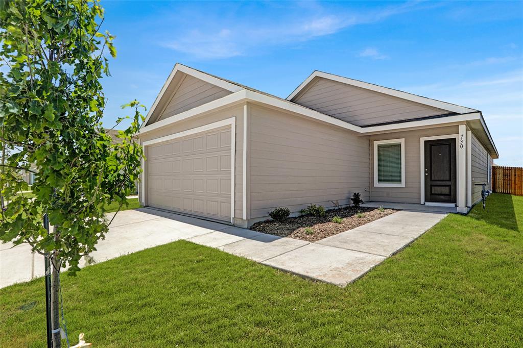 1033 Raintree Road Princeton, TX 75407 - Photo 1 of 25 a backyard of a house with seating space