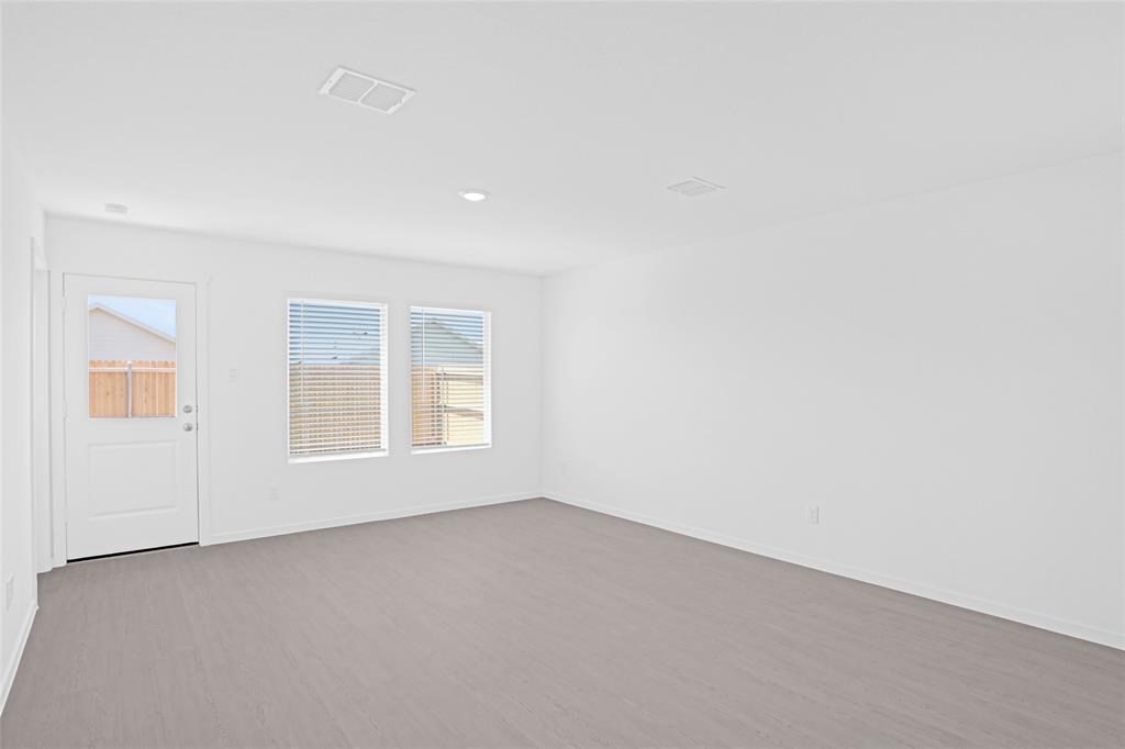 1033 Raintree Road Princeton, TX 75407 - Photo 12 of 26 an empty room with a window