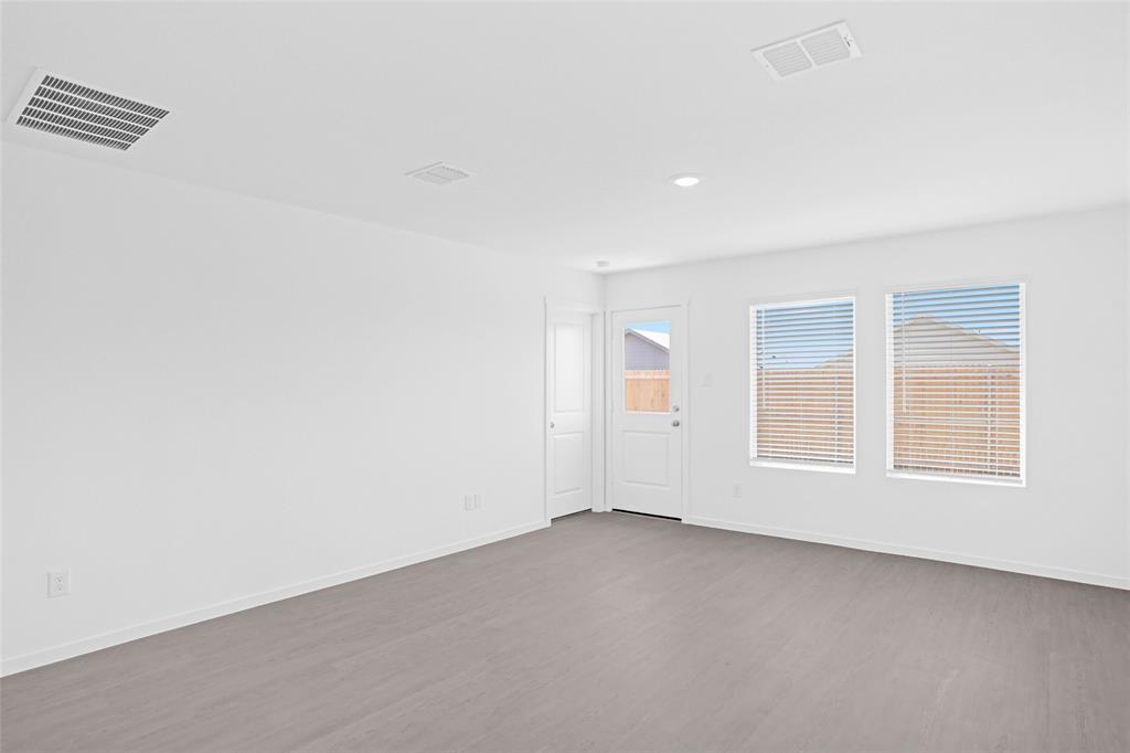 1033 Raintree Road Princeton, TX 75407 - Photo 15 of 26 an empty room with windows